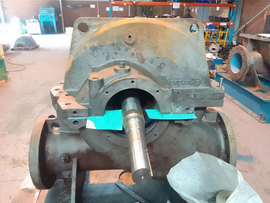 Industrial pump shaft and internal components exposed for mechanical inspection in the PCS workshop